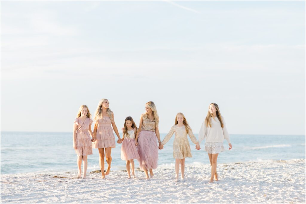 Clearwater beach family photoshoot. pastel beach photoshoot color palette. pastel beach photoshoot outfit inspo. tampa family photographer. 