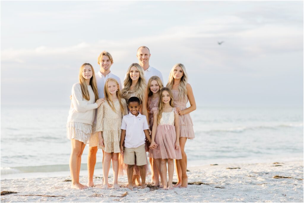 Clearwater beach family photoshoot. pastel beach photoshoot color palette. pastel beach photoshoot outfit inspo. tampa family photographer. 