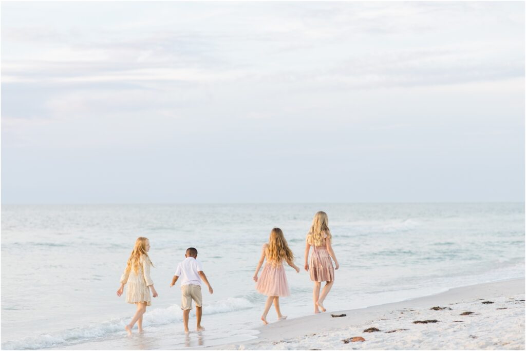 Clearwater beach family photoshoot. pastel beach photoshoot color palette. pastel beach photoshoot outfit inspo. tampa family photographer. 