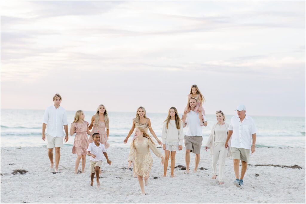 Clearwater beach family photoshoot. pastel beach photoshoot color palette. pastel beach photoshoot outfit inspo. tampa family photographer. 